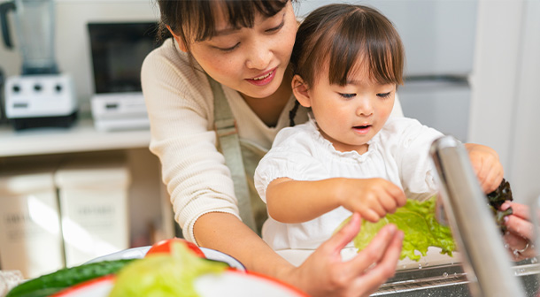 4-years-olds can help wash fruits and veggies with some help from mom or dad.
