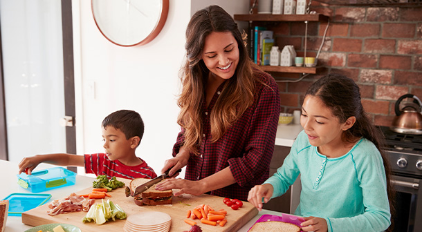 A mom uses time during morning lunch preparation to check in with her kids.